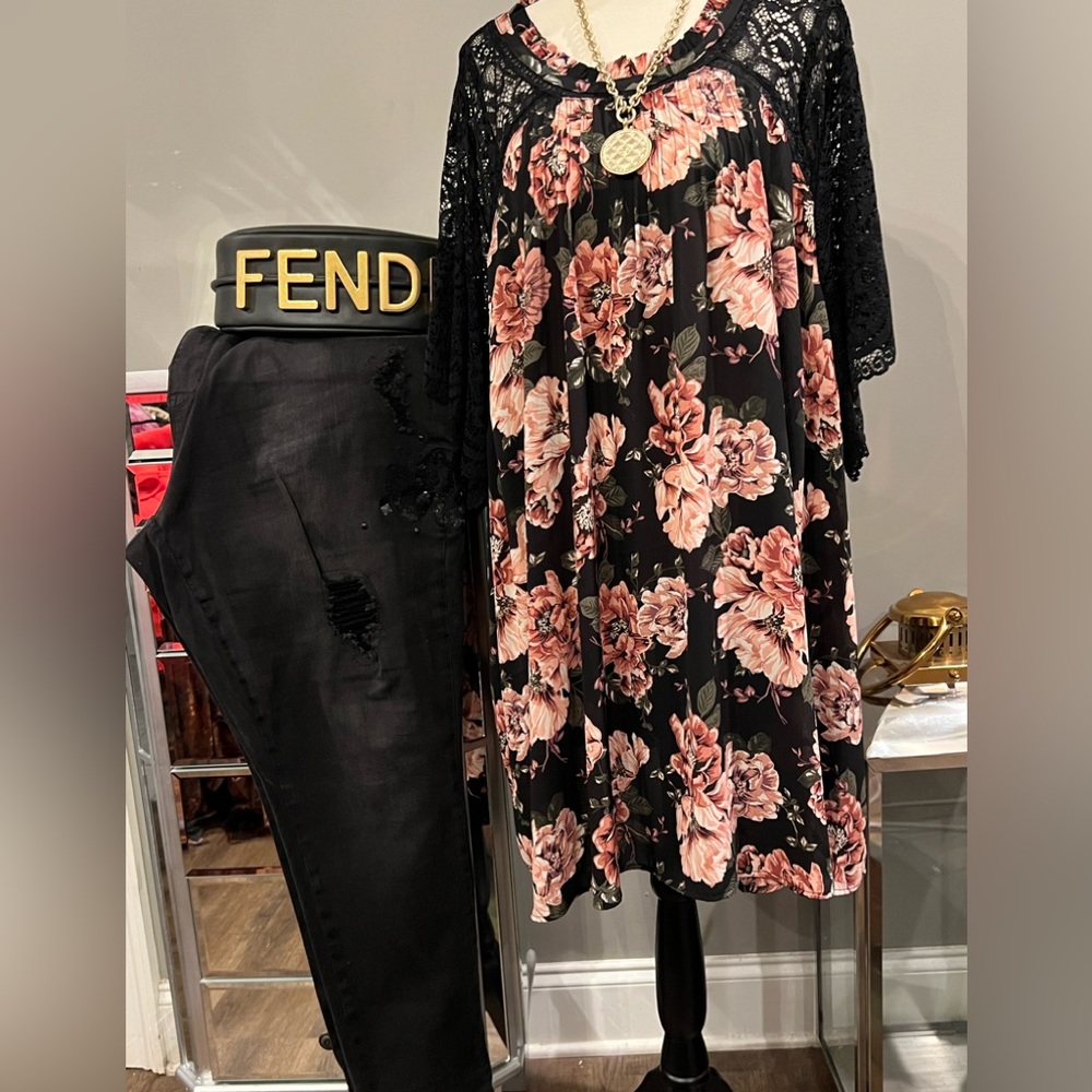 This top is lace and flowers. It is always cute vey thin but can use to layer